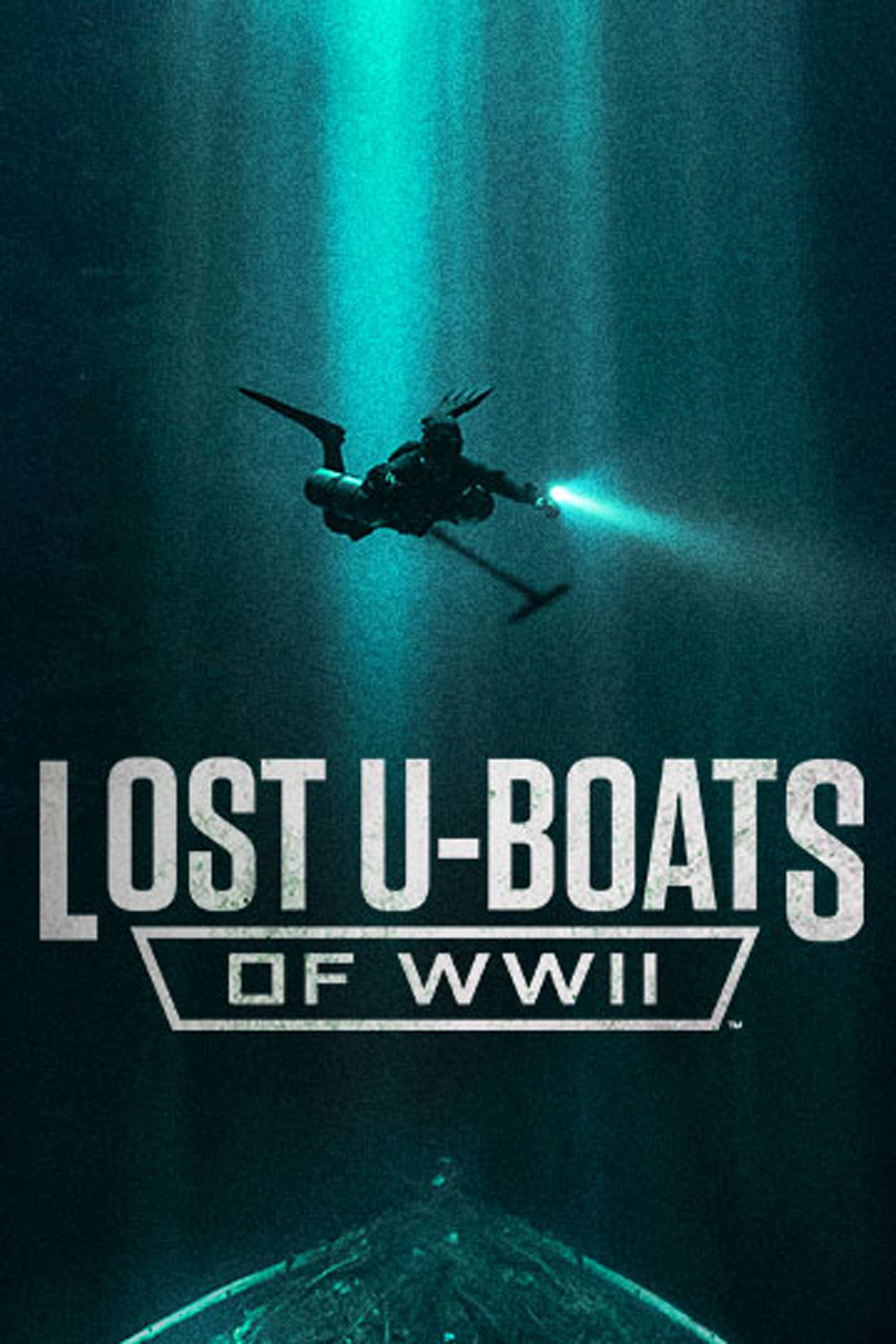 Lost U-Boats of WWII: scuba diver swimming underwater with a flashlight toward a sunken submarine in dark water.