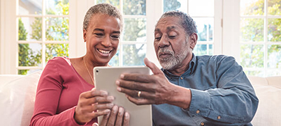 Couple looking at a tablet