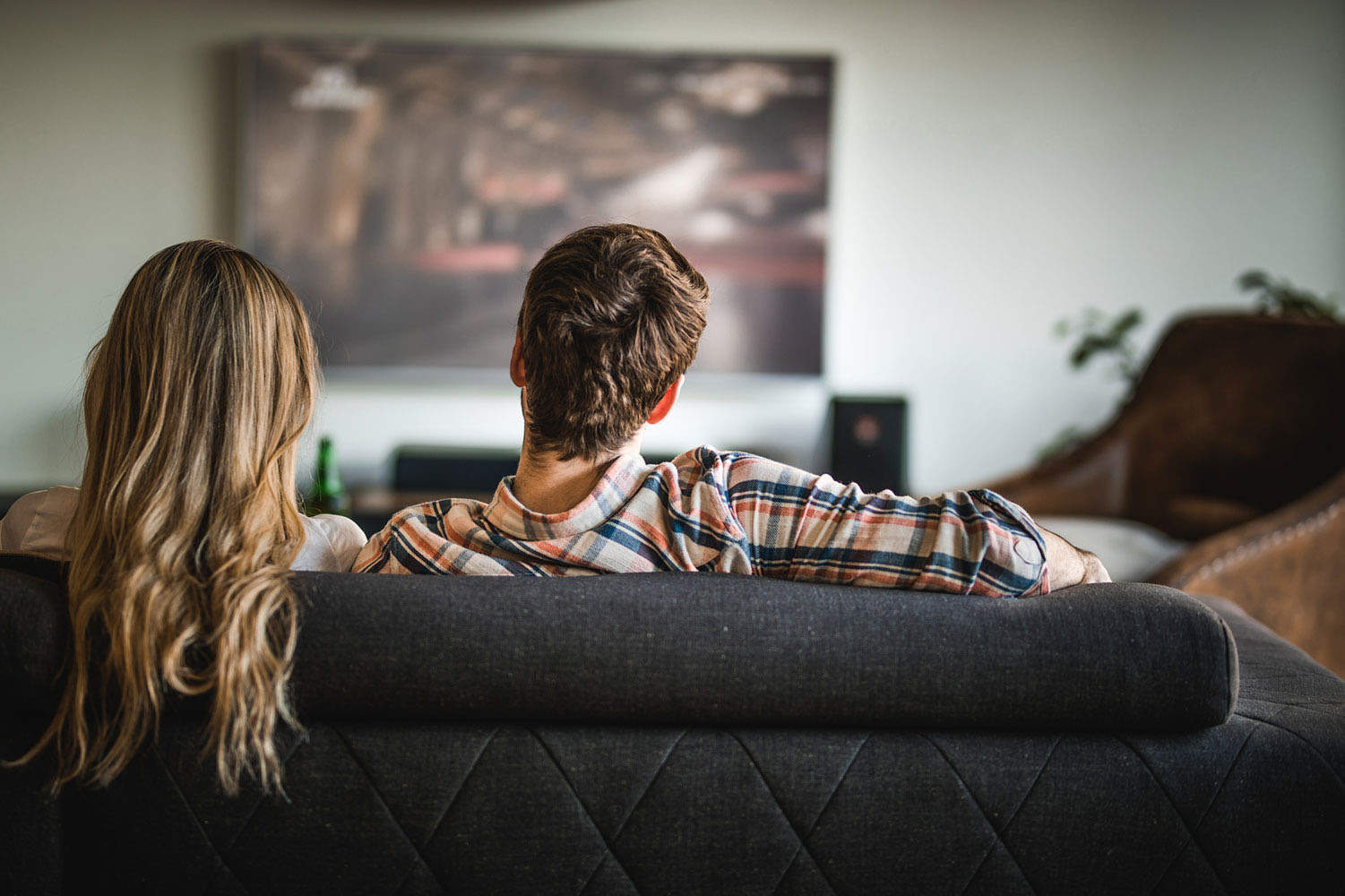 Family watching TV together